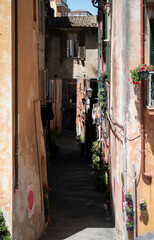 Fototapeta na wymiar A charming narrow European street in Perugia, Italy