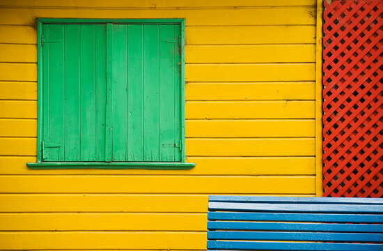 Colorful buildings and benches located in La Boca, Buenos Aires, Argentina.
