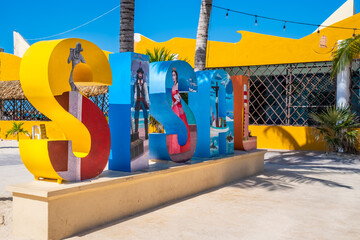 Colorful sign at the beach town of Sisal in Yucatan, Mexico - obrazy, fototapety, plakaty