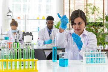 Young female scientist working with  tube test in laboratory