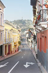 Fototapeta na wymiar Streets of the old town of Quito, Ecuador with view of Panecillo hill