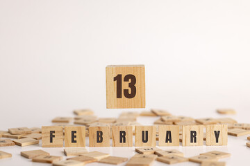 February 13  displayed wooden letter blocks on white background with room for print