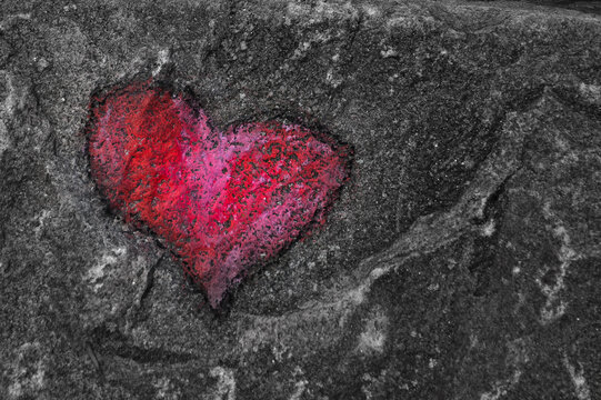 Painted Red Heart On A Gray Stone Close-up