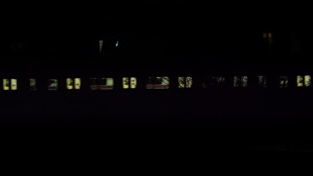 Tokyo, Japan - January 13, 2023: A train passing at night
