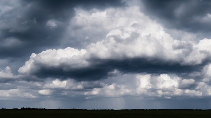 Obraz na płótnie Canvas Grey and white clouds against a blue sky.