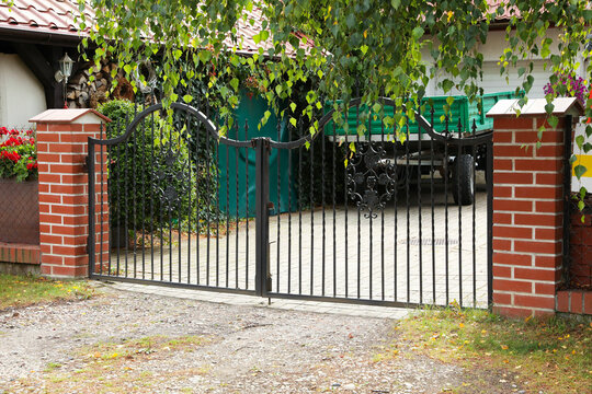 Black metal gates near private house on street