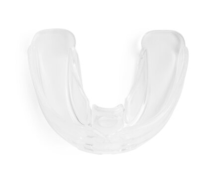 Transparent dental mouth guard isolated on white, top view. Bite correction