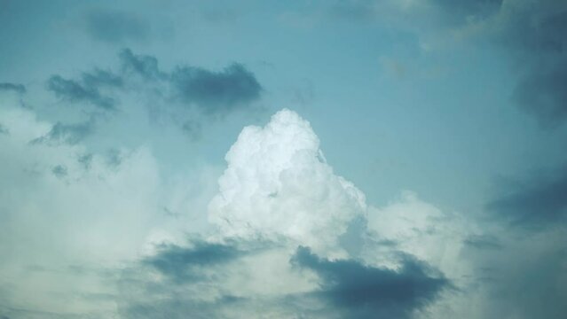 Timelapse of beautiful lush clouds. Nuclear explosion. A cloud in the form of a mushroom. An amazing natural formation of large cumulus clouds that appear to be moving like an explosion in the sky.