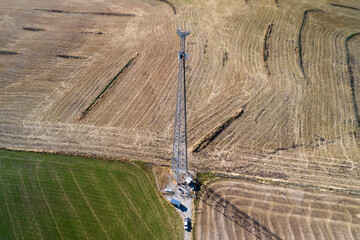Cell tower is being prepared by climber tower. Aerial view on antenna tower during changing cellphones antennas.