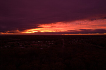 Red sunset in Illionois look from drone. Aerial view of red sunset in the USA