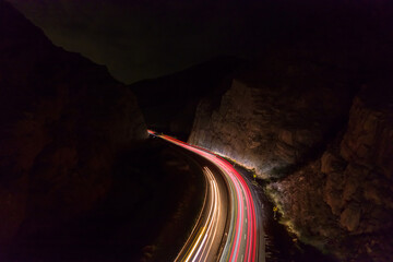 Traffic in highway through Mountani at night. Light from cars on long exposure