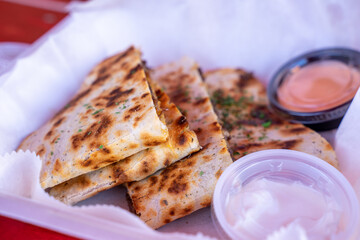 Assimilation of a sandwich as a mini pizza. There are photo and vector versions for design idea. The sandwich is added with cheese, hams, pickled olive and then baked. Served with ketchup or chilis
