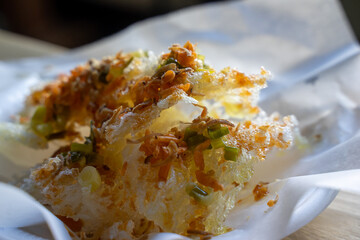 Fusion Vietnamese cuisine with fried sticky rice. Traditionally, the sticky rice is cooked, added with cooked dried shrimps, onion sauce, pork floss or shredded pork. But this style is seen with the 