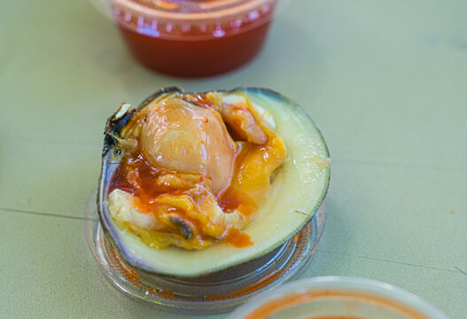 Enjoying raw clams. Raw food may cause food poisoning, diarrhea, or deadly sickness because of bacteria from E. coli to salmonella. But raw seafood bring juicy and tasty flavor that hard to resist