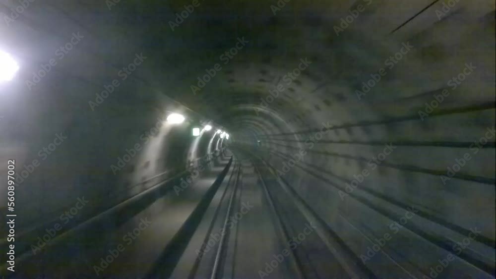 Poster underground tunnel. forward view from a train traveling through a tunnel.