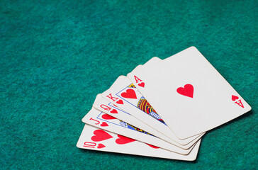 Playing Card on Green Table In Casino, Royal Flush card