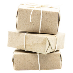 three natural brown gift boxes or parcels with cord ribbon