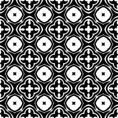 Seamless pattern of black shapes on white background.