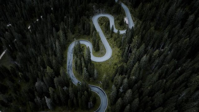 Aerial drone footage of snake road Passo Giau, cars, travel, road. Recorded in 4k, 60fps.