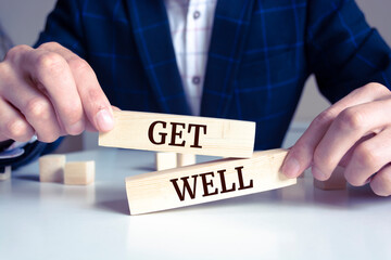 Closeup on businessman holding a wooden block with 