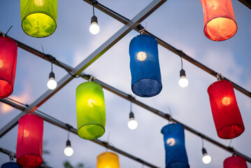 Bright colorful lanterns hanging in the evening