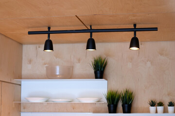 Track metal lamps in the loft interior