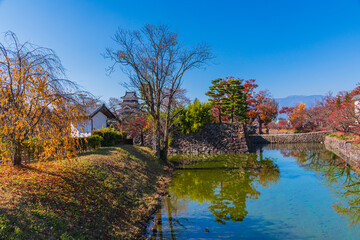 Obraz premium Matsumoto Castle is one of Japan's premier historic castle. It is located in the city of Mastumoto ,Nagano prefecture. Castle is surrounded by moat.