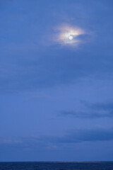 Full moon reflection on Atlantic Ocean during night seen from luxury ocean liner cruiseship cruise...