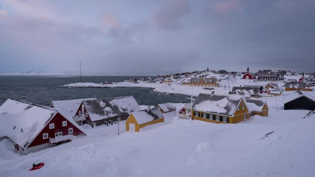 Time Lapse clip of the old colonial harbor and the red church (Nuuk Cathedral) in the background in Nuuk, Greenland during winter