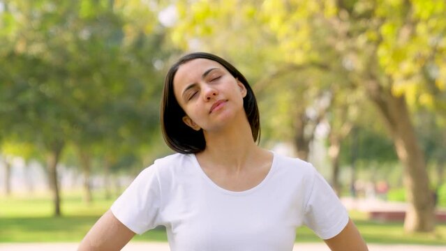 Indian woman doing neck exercise