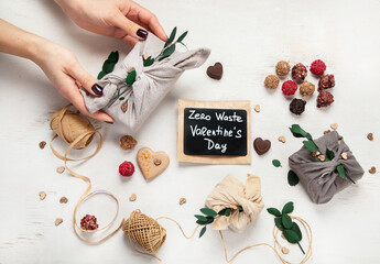 Valentine's Day Zero Waste Concept. Eco-friendly linen packaging as a gift for Valentine's Day in furoshiki style. Simple eco presents plastic free.