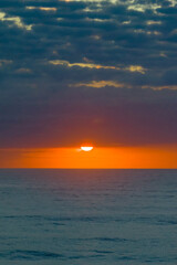 Fototapeta premium Beautiful sunrise with clouds over the ocean