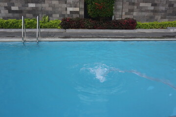 Swimming pool water surface on background and sunshine texture wallpaper