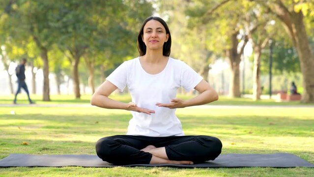 Indian girl doing breathe in breathe out exercise
