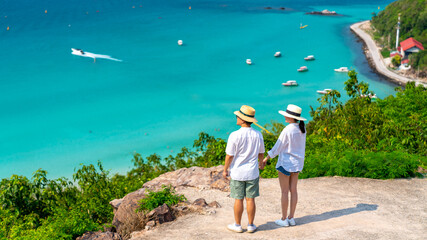 Happy Asian family couple enjoy outdoor lifestyle travel tropical island on summer holiday...
