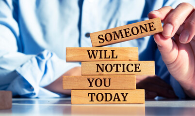 Closeup on businessman holding a wooden block with 