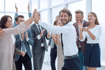 happy young businessman on business team background.