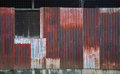 old rusty galvanized, corrugated iron siding vintage texture background