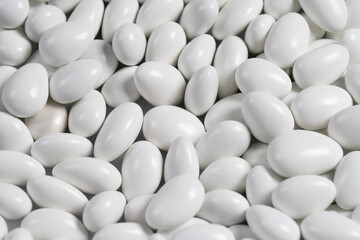 Fototapeta premium Almond candy in the form of a heap. Sugar coated on the outside, almond on the inside. close up