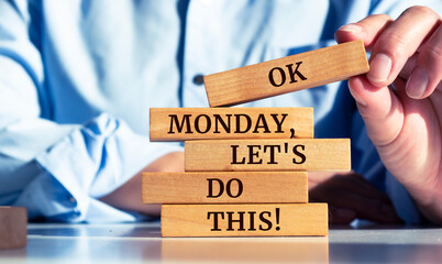 Closeup on businessman holding a wooden block with 