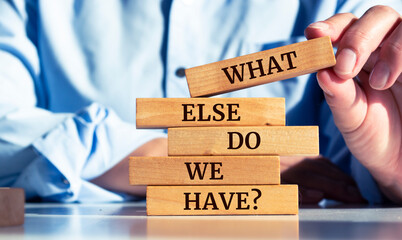 Closeup on businessman holding a wooden block with 