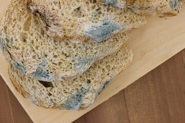 Close-up of Moldy bread on cutting board