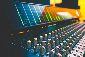 VU meter on audio mixing console meter bridge and knobs. Recording, broadcasting concept. Music...
