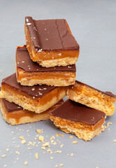 Rustic style millionaires’ shortbread blocks with crumbs