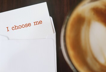 Blur coffee cup with note typed text I CHOOSE ME, concept of self love affirmation, learn to love  and have healthy relationship with oneself.