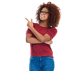 Black woman, pointing finger and studio with smile, beauty and casual clothes by white background. Woman, isolated model and hand sign with fashion, jeans and glasses on face with natural afro hair