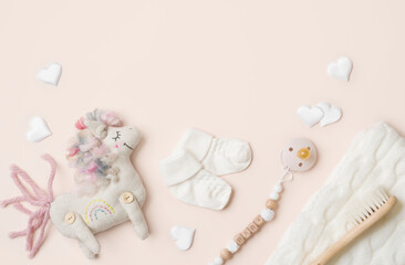 Baby products background with soft horse toy and other essentials