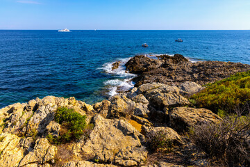 Rocky shoreline landscape of Saint-Jean-Cap-Ferrat resort town on Cap Ferrat cape at Azure Coast French Riviera of Mediterranean Sea in France