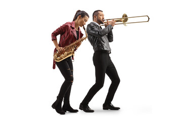 Full length shot of a young woman playing a sax and man playing a trombone