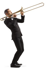 Full length profile shot of a man in a black suit playing a trombone - obrazy, fototapety, plakaty